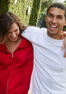 man and a woman wearing Hanes product